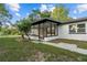 The house boasts an enclosed patio addition, enhancing its curb appeal at 221 S Kingsway Rd, Seffner, FL 33584