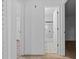 Hallway leading to a bathroom with modern tile floors and a shower at 221 S Kingsway Rd, Seffner, FL 33584