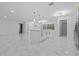 Kitchen and living space featuring marble floors, a kitchen island, and stainless steel appliances at 221 S Kingsway Rd, Seffner, FL 33584