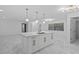 Bright kitchen featuring a large island with marble countertops and a gold faucet at 221 S Kingsway Rd, Seffner, FL 33584