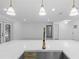 Modern kitchen featuring a large island with marble countertops and stainless steel appliances at 221 S Kingsway Rd, Seffner, FL 33584