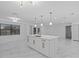 Spacious kitchen featuring a large island with marble countertops and a gold faucet at 221 S Kingsway Rd, Seffner, FL 33584