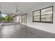 View of covered patio including ceiling fan and backyard view at 221 S Kingsway Rd, Seffner, FL 33584