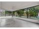 View of the screened patio that offers outdoor space and a backyard view with mature trees at 221 S Kingsway Rd, Seffner, FL 33584