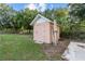 Backyard shed with ladder and an adjacent patio at 221 S Kingsway Rd, Seffner, FL 33584