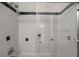 Close-up of a tiled shower with a glass door and a shower head at 221 S Kingsway Rd, Seffner, FL 33584