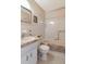 This bathroom features a vanity with a marble countertop and a shower/tub combo with grab bars at 2253 Norwegian Dr # 27, Clearwater, FL 33763