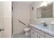 Bathroom features a unique blue sink and matching tile, plus a convenient walk-in shower at 2253 Norwegian Dr # 27, Clearwater, FL 33763
