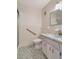 The bathroom boasts unique blue accents and a shower, designed for both style and accessibility at 2253 Norwegian Dr # 27, Clearwater, FL 33763