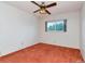 Relax in this bedroom featuring soft orange carpet, a ceiling fan, and bright outdoor light at 2253 Norwegian Dr # 27, Clearwater, FL 33763