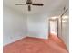A bedroom with a ceiling fan, and an attached hallway at 2253 Norwegian Dr # 27, Clearwater, FL 33763