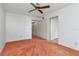 This bedroom features plush orange carpet, a ceiling fan, and a spacious closet at 2253 Norwegian Dr # 27, Clearwater, FL 33763