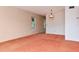 Spacious living room with large windows and a decorative chandelier, perfect for entertaining guests at 2253 Norwegian Dr # 27, Clearwater, FL 33763
