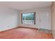 Cozy living room featuring a large window with natural light, creating a comfortable and inviting ambiance at 2253 Norwegian Dr # 27, Clearwater, FL 33763