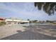 A large outdoor pool with multiple lounge chairs at 2253 Norwegian Dr # 27, Clearwater, FL 33763