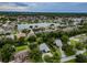 Aerial photo of the community, highlighting neighborhood homes around the lake, and streets at 22946 Brownwood Ct, Land O Lakes, FL 34639