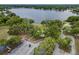 Aerial shot with a playground, parking area and a scenic lake for community enjoyment at 22946 Brownwood Ct, Land O Lakes, FL 34639