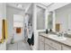 Bright bathroom with shower-tub combo, skylight, and granite countertop at 22946 Brownwood Ct, Land O Lakes, FL 34639