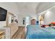 Bright primary bedroom featuring a large closet, light hardwood floors, and ensuite bathroom at 22946 Brownwood Ct, Land O Lakes, FL 34639