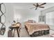 Bedroom features a ceiling fan, desk area, and neutral color palette at 22946 Brownwood Ct, Land O Lakes, FL 34639