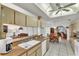 Open kitchen with bright lighting overlooking the breakfast nook and living areas at 22946 Brownwood Ct, Land O Lakes, FL 34639