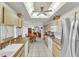 Spacious kitchen with natural light, light wood cabinets and stainless steel refrigerator at 22946 Brownwood Ct, Land O Lakes, FL 34639