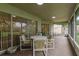 Screened lanai with neutral carpet and comfortable seating at 22946 Brownwood Ct, Land O Lakes, FL 34639