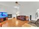 Inviting living room with cozy fireplace, wood floors, and media center at 22946 Brownwood Ct, Land O Lakes, FL 34639