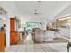 Open-concept living room with wood floors, neutral colors, and plenty of natural light at 22946 Brownwood Ct, Land O Lakes, FL 34639