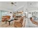 Spacious living room featuring wood floors, comfortable seating, and an open floor plan at 22946 Brownwood Ct, Land O Lakes, FL 34639