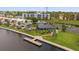 Aerial view of waterfront community with canal, docks, pool, and landscaping at 2424 W Tampa Bay Blvd # G204, Tampa, FL 33607