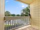 Balcony view overlooking tropical trees and water at 2424 W Tampa Bay Blvd # G204, Tampa, FL 33607
