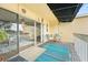 A covered balcony featuring colorful rugs and chairs for relaxing at 2424 W Tampa Bay Blvd # G204, Tampa, FL 33607