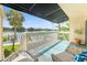Balcony with covered awning overlooking waterfront views and a railing at 2424 W Tampa Bay Blvd # G204, Tampa, FL 33607