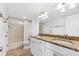 Bathroom featuring double sinks with granite countertops and tiled floor at 2424 W Tampa Bay Blvd # G204, Tampa, FL 33607