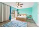 Airy bedroom with a king bed, water view, and private balcony access at 2424 W Tampa Bay Blvd # G204, Tampa, FL 33607