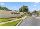 Community sign for 'The Marina Club' with well-maintained landscaping and gated entrance at 2424 W Tampa Bay Blvd # G204, Tampa, FL 33607