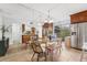 Charming dining room featuring a modern glass table and bright window view at 2424 W Tampa Bay Blvd # G204, Tampa, FL 33607