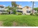 Exterior view of the condo featuring multiple units, balconies, and stairs at 2424 W Tampa Bay Blvd # G204, Tampa, FL 33607