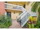 View of a condo exterior, showcasing a well-maintained building and verdant foliage at 2424 W Tampa Bay Blvd # G204, Tampa, FL 33607