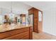 Kitchen featuring stainless steel appliances, wood cabinetry, granite counter tops and an adjacent dining area at 2424 W Tampa Bay Blvd # G204, Tampa, FL 33607