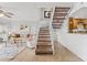Cozy living room features tile flooring, a staircase, and stylish decor elements at 2424 W Tampa Bay Blvd # G204, Tampa, FL 33607