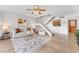 Comfortable living area boasts tile flooring, a ceiling fan, and a staircase to the upper level at 2424 W Tampa Bay Blvd # G204, Tampa, FL 33607