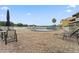 Community pool area featuring lounge chairs and tables by the water at 2424 W Tampa Bay Blvd # G204, Tampa, FL 33607
