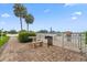 Pool area with a BBQ grill, table, bench, and lush landscaping at 2424 W Tampa Bay Blvd # G204, Tampa, FL 33607