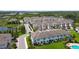 An aerial view of a townhome community with well-maintained lawns and mature landscaping at 2432 Golden Pasture Cir, Clearwater, FL 33764