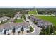 An aerial view of a residential community featuring manicured lawns and modern townhome architecture at 2432 Golden Pasture Cir, Clearwater, FL 33764