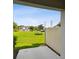 Relaxing backyard view with a lush lawn and a white fence adding a cozy touch at 2432 Golden Pasture Cir, Clearwater, FL 33764
