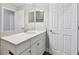 Bathroom featuring a bright vanity with a white countertop and ample storage at 2432 Golden Pasture Cir, Clearwater, FL 33764