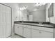 Elegant bathroom with double sinks, ample storage and quartz countertop is perfect for busy mornings at 2432 Golden Pasture Cir, Clearwater, FL 33764